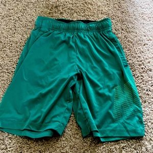 green nike shorts, size medium